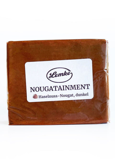 Verpackter dunkler Haselnuss-Nougat von Lemke mit Produktetikett
