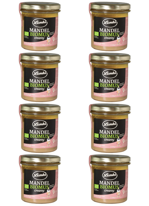 Acht Gläser Lemke Mandel Biomus creamy 300 g auf weißem Hintergrund