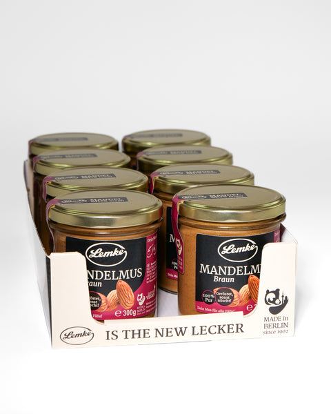 Lemke Mandelmus Braun 300g roasted almond butter jars in a retail display box on a white background
