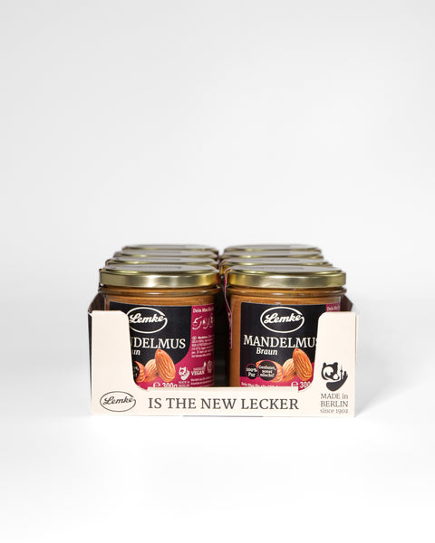 Lemke Mandelmus Braun 300g almond butter jars arranged in a retail display box