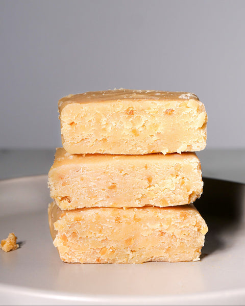 Stacked pieces of Lemke Marzipan Heavenly Grace on a white plate background