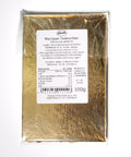 Back view of Lemke Marzipan Teekonfekt 100g package with product label on gold tray