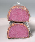 Cut pieces of Lemke Marzipanini Very Cherry with pink cherry marzipan filling and chocolate coating