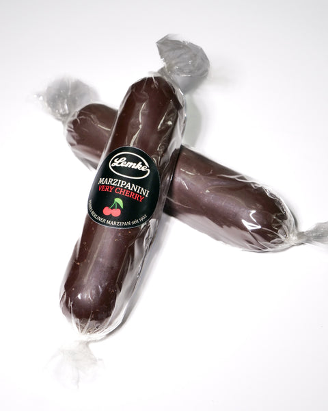 Two Lemke Marzipanini Very Cherry 120g chocolate-coated marzipan loaves in clear wrapping