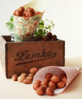 Lemke marzipan potatoes served in paper cones with almonds and decorative Lemke wooden box