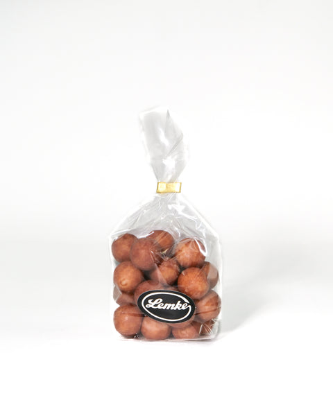 Lemke Marzipankartoffeln Zimt 200g transparent bag with cinnamon coated marzipan potatoes on white background