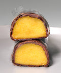 Cut pieces of Lemke Marzipanini Sunny Orange with orange marzipan filling and chocolate coating